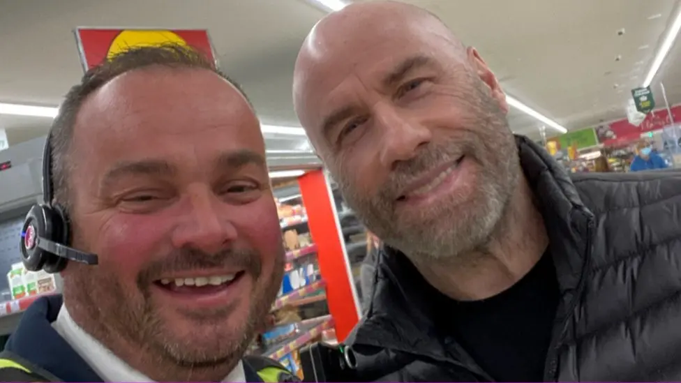 John Travolta poses for photos in Norfolk Morrisons and Wetherspoon