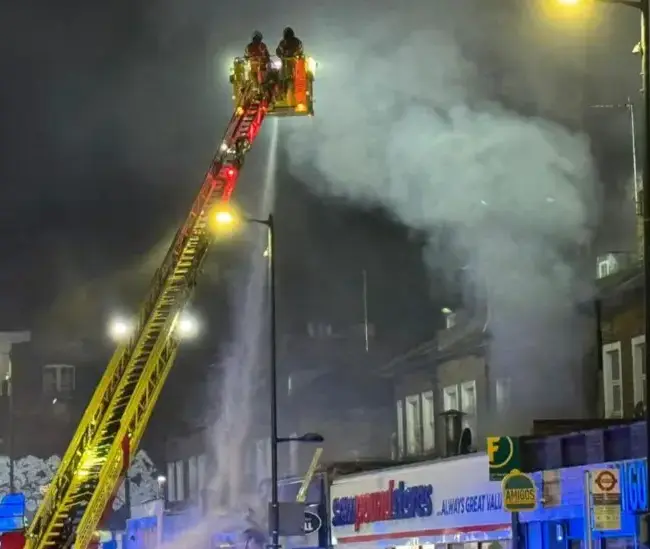 Two men arrested after Holloway takeaway fire