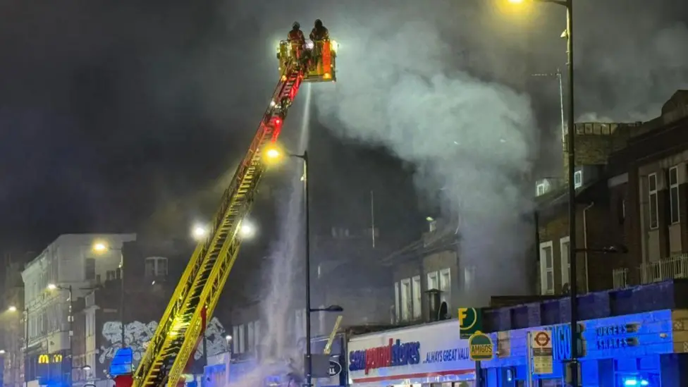 Two men arrested after Holloway takeaway fire